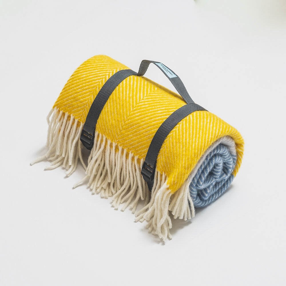 Rolled yellow wool blanket on white, clean e-commerce product photography in Cornwall
