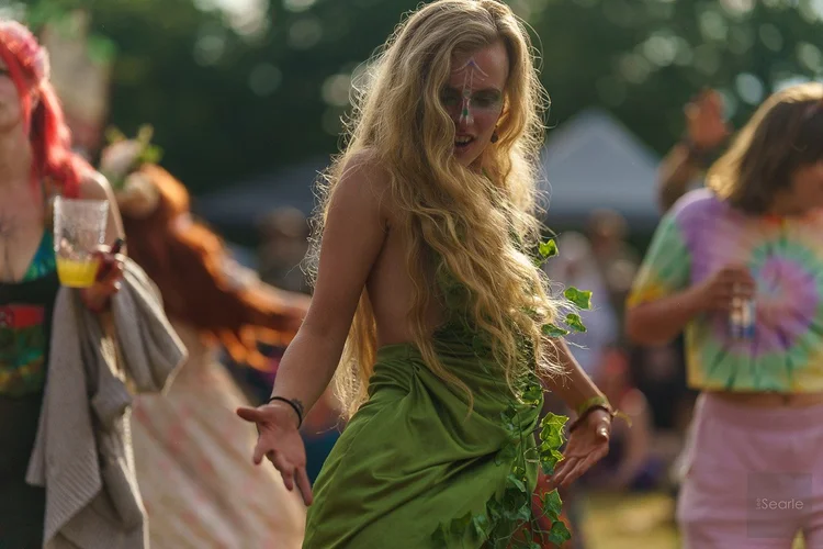 Festival dancer in ivy and face paint at a Cornish fairy festival