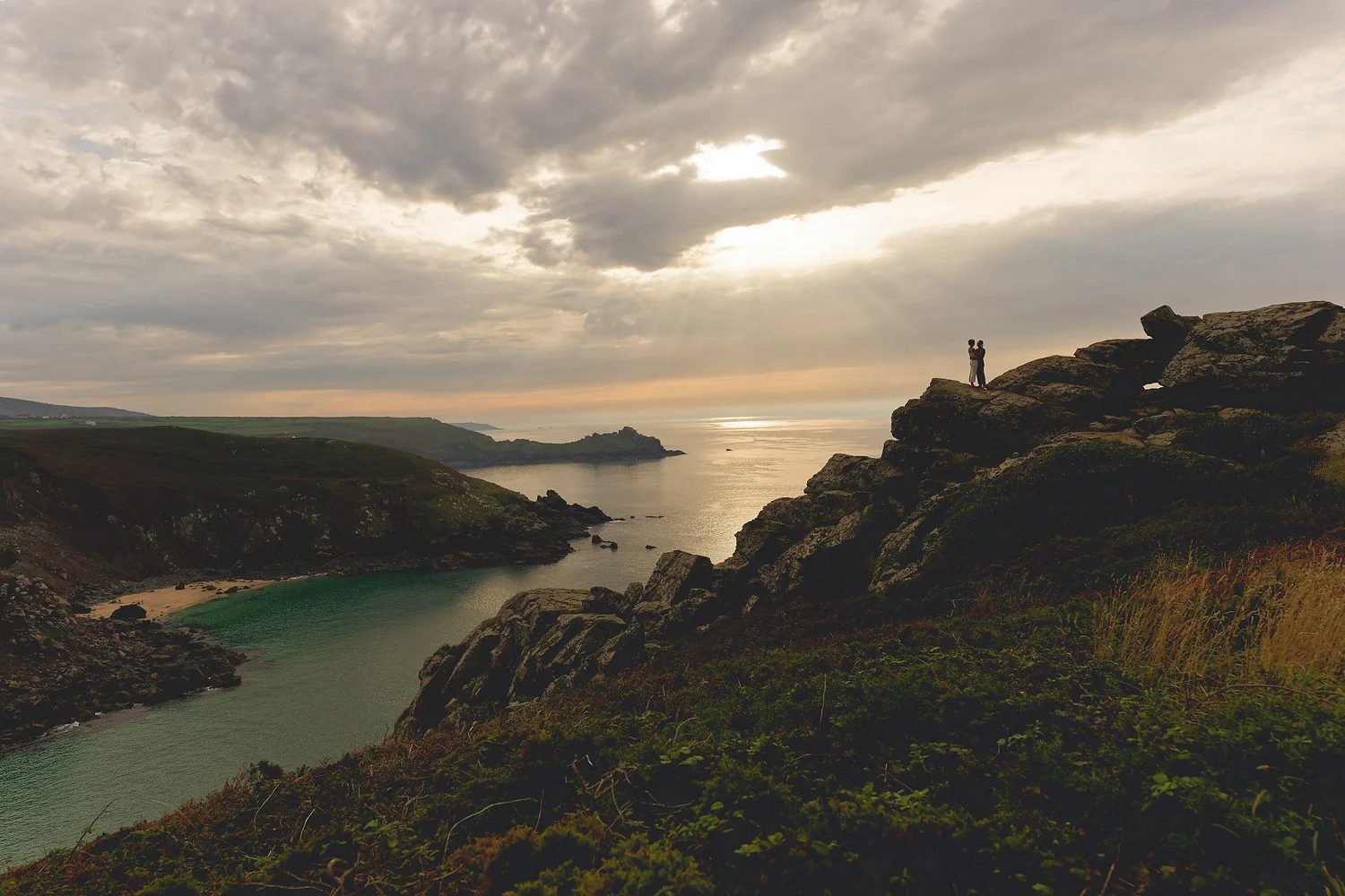 Couple standing on the clifftops above Zennor at dusk