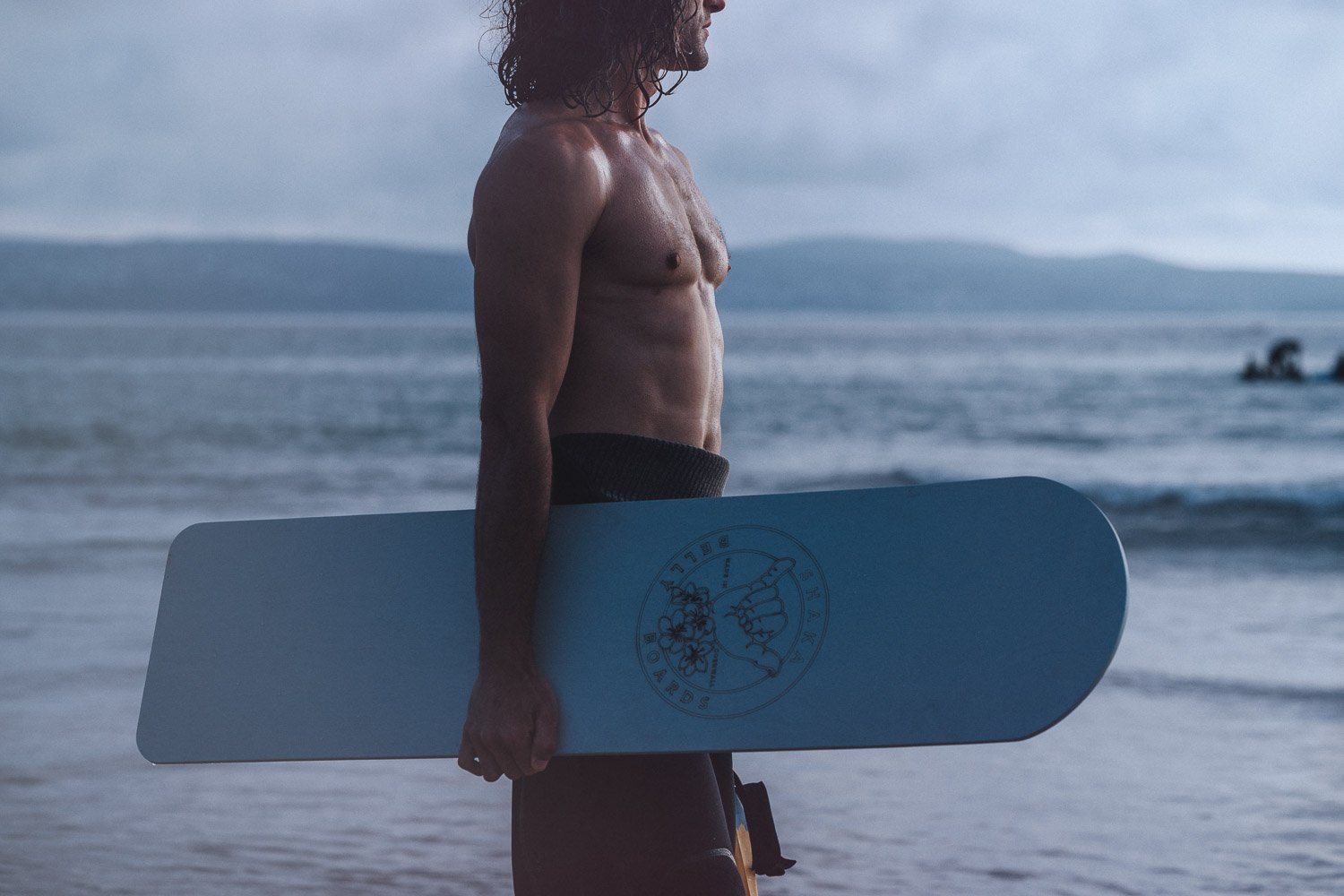 Bodyboard brand photography on a Cornish beach at first light